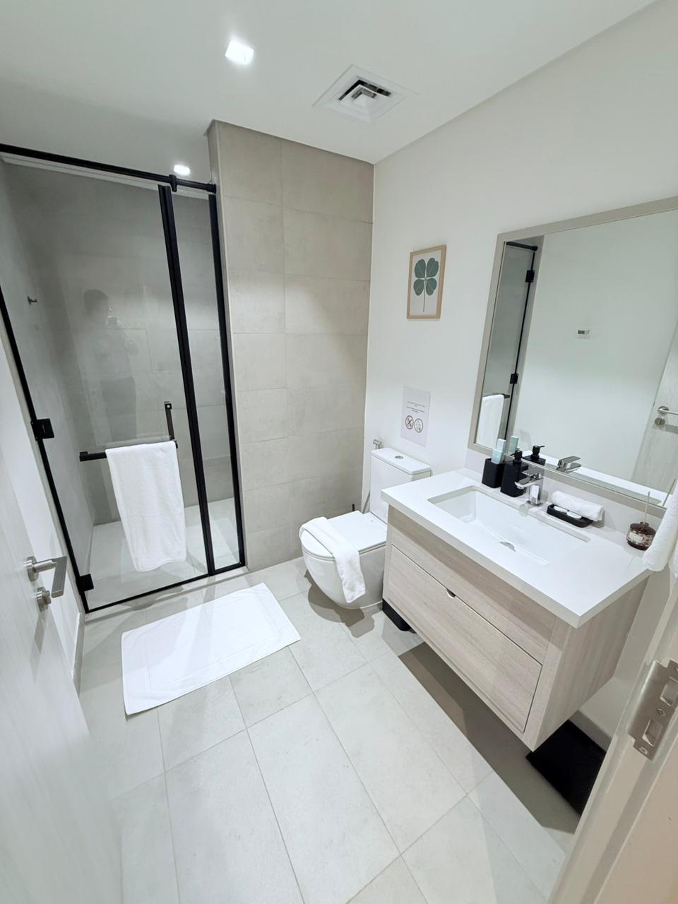 Clean guest-ready bathroom with walk-in shower