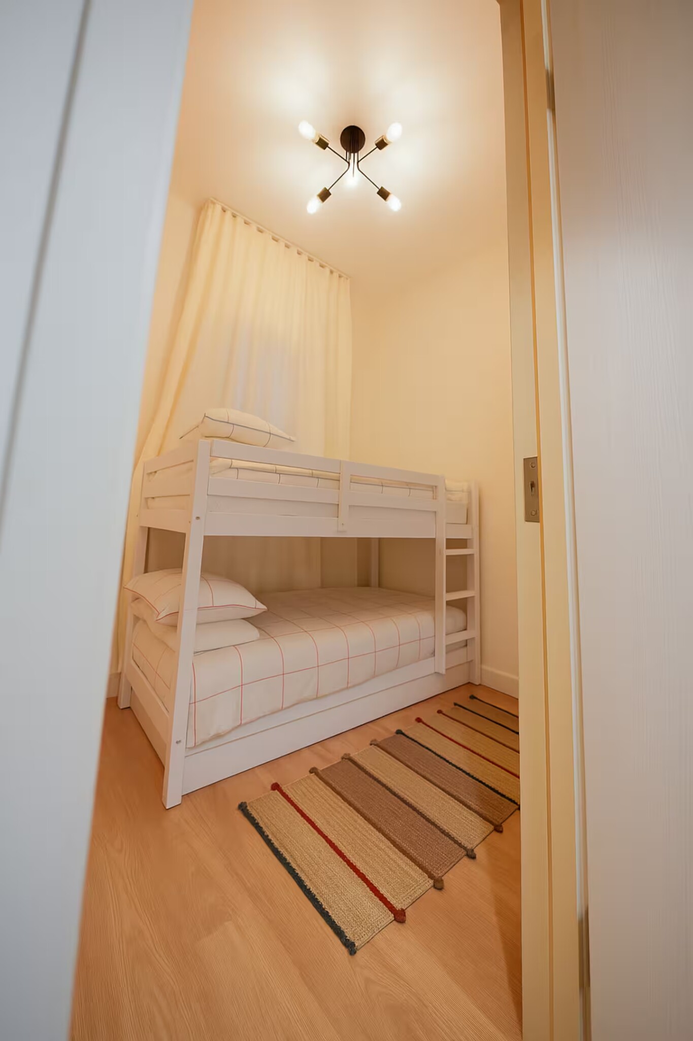 Ground-floor bunk room at Noya Viva Family Villa