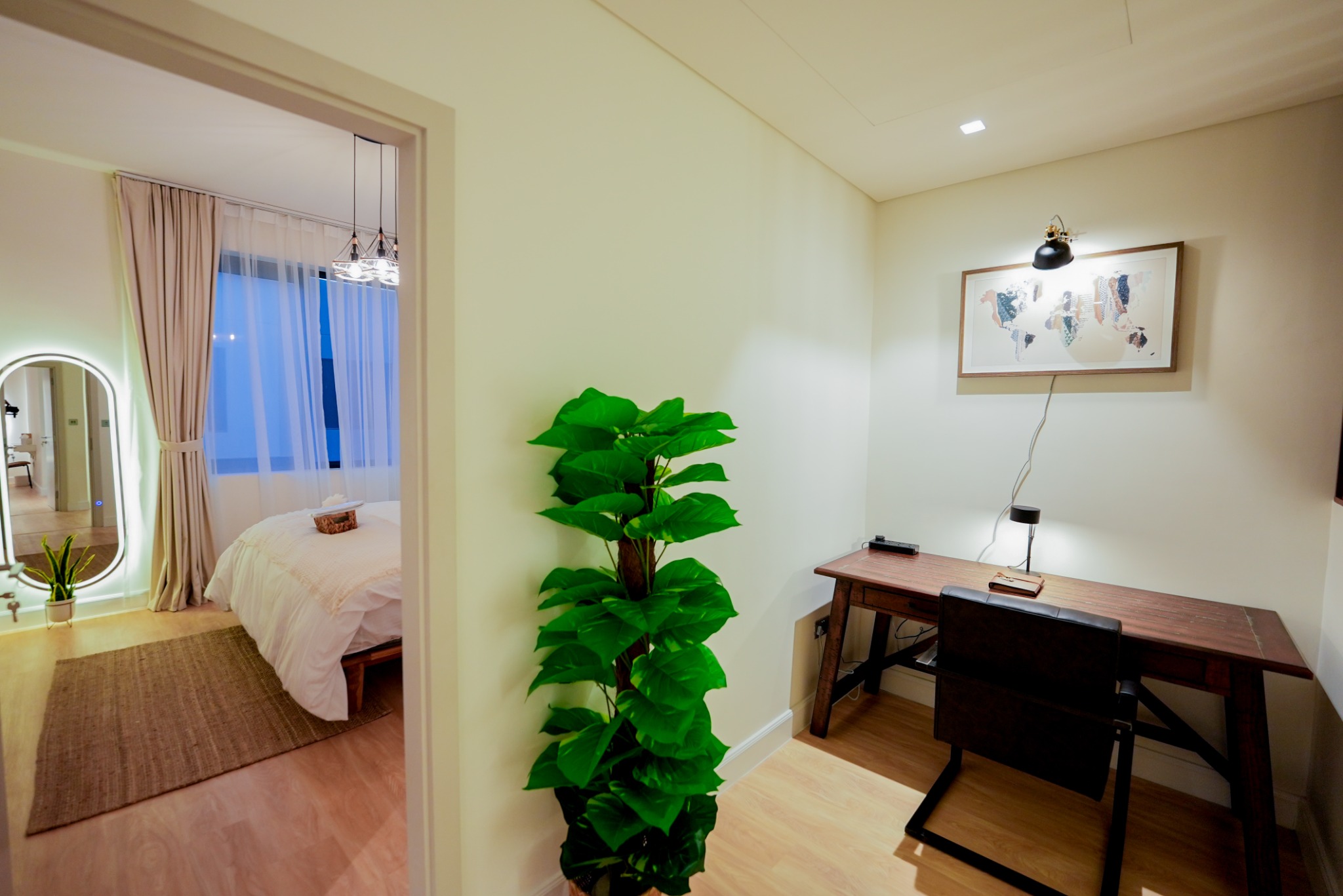 Dedicated workspace beside a private bedroom